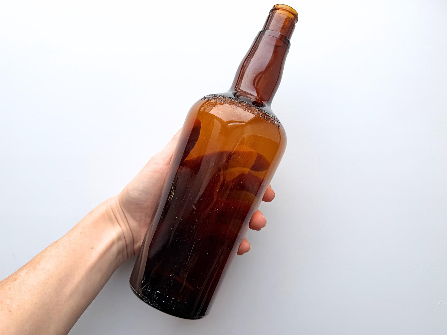 Vintage 1951 wide shoulder whisky bottle with distinctive shape and Owens Illinois marking. Excellent condition. Perfect for collectors of unusual bottle shapes.