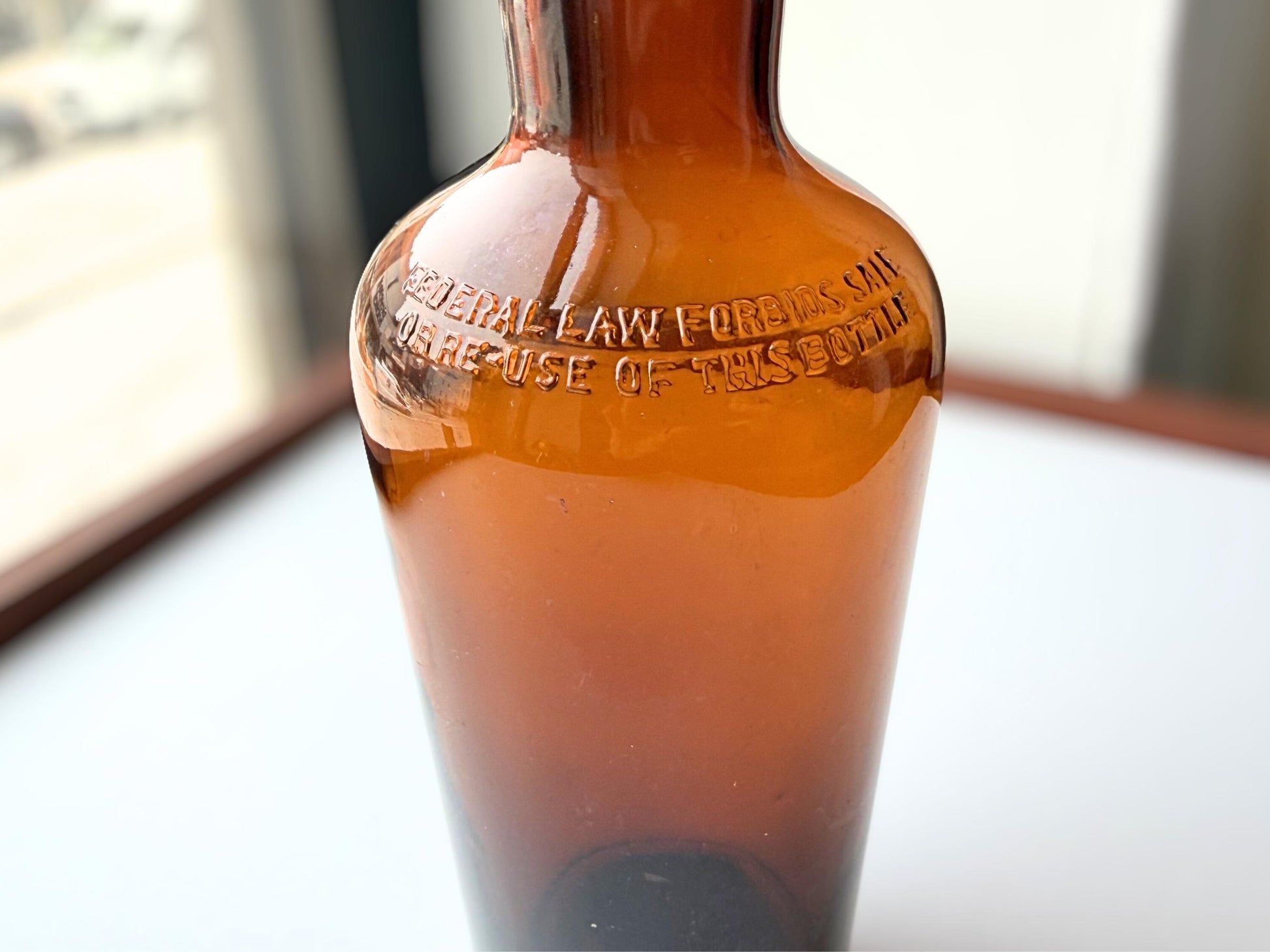 Vintage 1951 wide shoulder whisky bottle with distinctive shape and Owens Illinois marking. Excellent condition. Perfect for collectors of unusual bottle shapes.