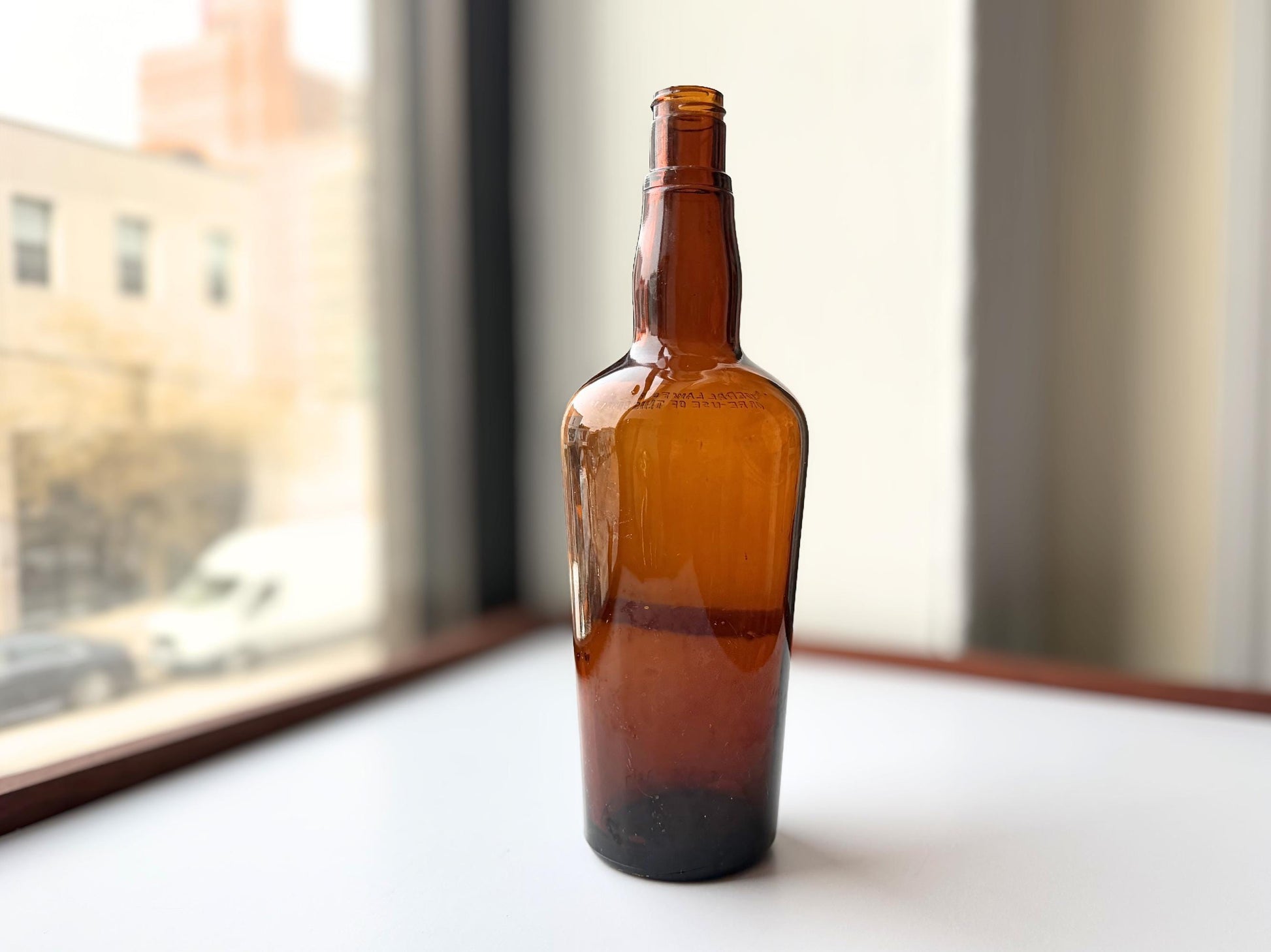Vintage 1951 wide shoulder whisky bottle with distinctive shape and Owens Illinois marking. Excellent condition. Perfect for collectors of unusual bottle shapes.