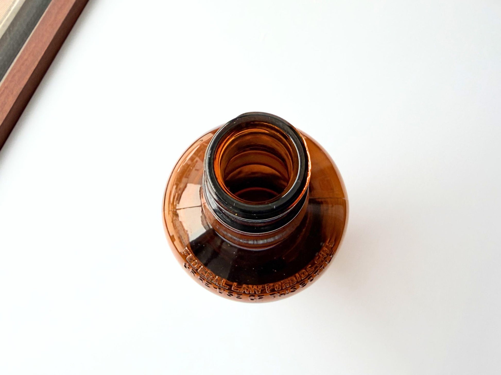 Vintage 1951 wide shoulder whisky bottle with distinctive shape and Owens Illinois marking. Excellent condition. Perfect for collectors of unusual bottle shapes.