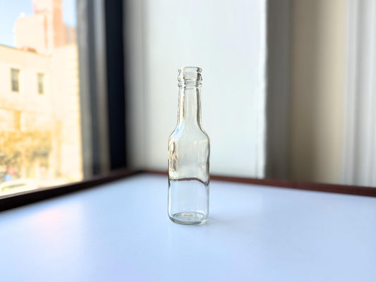 Vintage 1952 clear corktop bottle with distinctive cork-sealed top and production marking. Perfect for vintage kitchen collectors, farmhouse displays, apothecary decor, and cottagecore styling. Good condition clear glass bottle ideal for flowers, sto