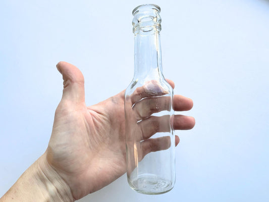 Vintage 1952 clear corktop bottle with distinctive cork-sealed top and production marking. Perfect for vintage kitchen collectors, farmhouse displays, apothecary decor, and cottagecore styling. Good condition clear glass bottle ideal for flowers, sto
