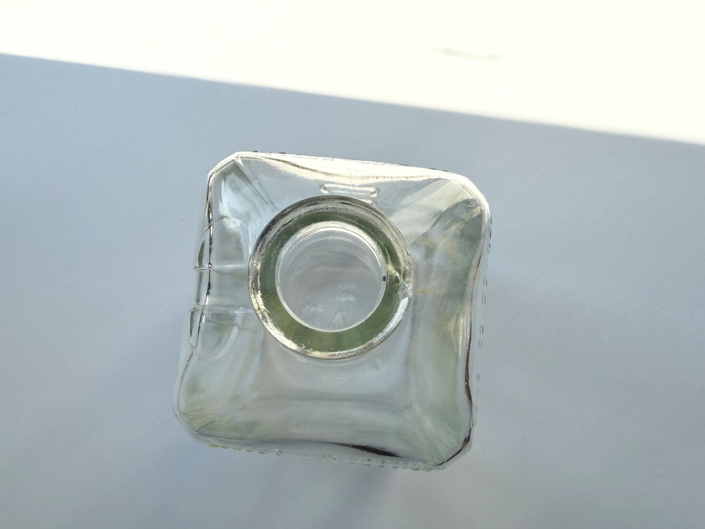 Vintage 1952 Cointreau clear glass liqueur flask 7.5 inches tall with COINTREAU and LIQUEUR embossing - French spirits collector piece hand-recovered from NYC, small chip on mouth