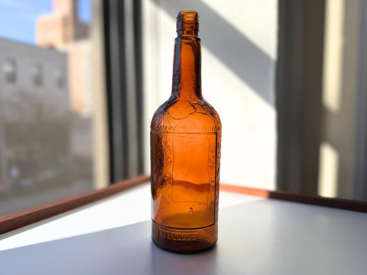 Vintage 1952 Lord Calvert whisky bottle with Made in USA marking. Excellent condition. Perfect for American whisky and vintage spirits collectors.