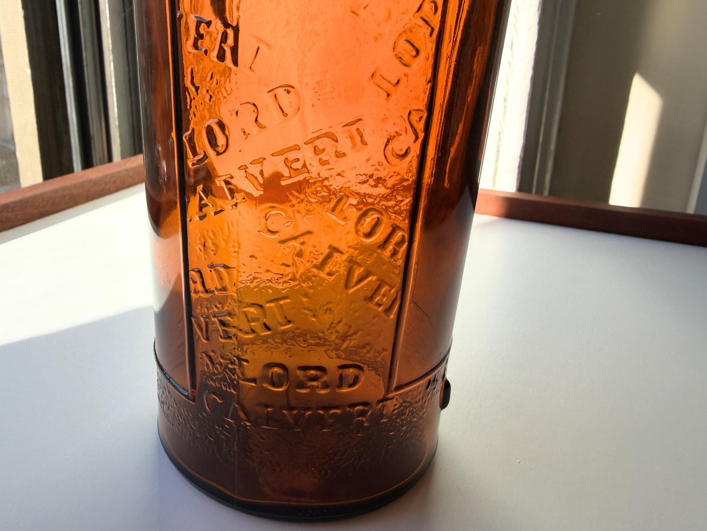 Vintage 1952 Lord Calvert whisky bottle with Made in USA marking. Excellent condition. Perfect for American whisky and vintage spirits collectors.