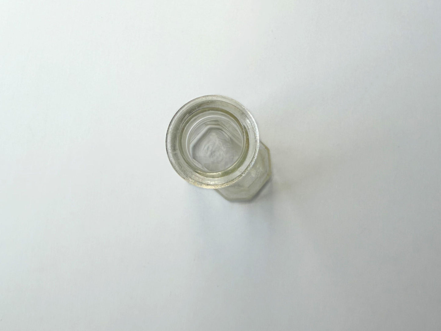 Vintage clear glass Ace shoe polish bottle 4.25 inches tall with bold ace-of-spades embossed logo - mid-century American collector piece hand-recovered from NYC
