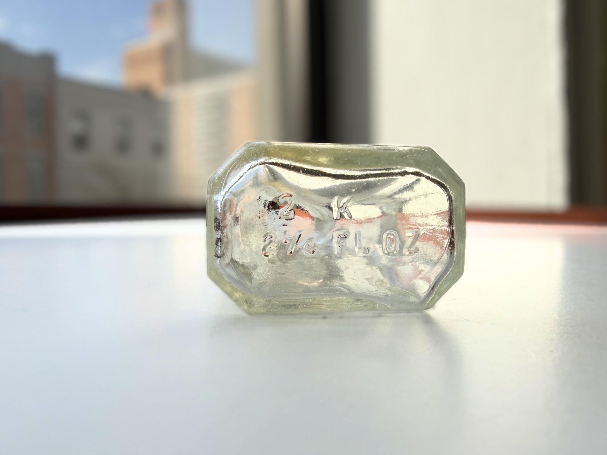 Vintage clear glass Ace shoe polish bottle 4.25 inches tall with bold ace-of-spades embossed logo - mid-century American collector piece hand-recovered from NYC