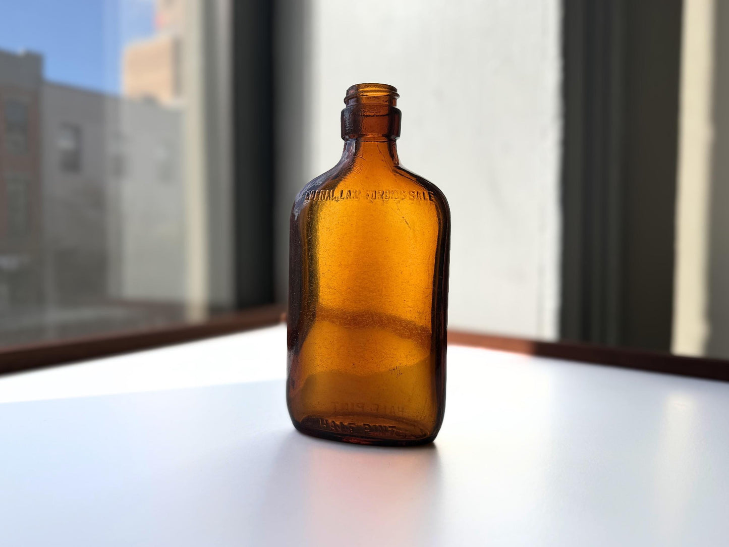 Vintage amber Federal Law flask 6.75 inches tall with beach-worn patina throughout - small chip on mouth - hand-recovered from NYC mid-century dumping grounds