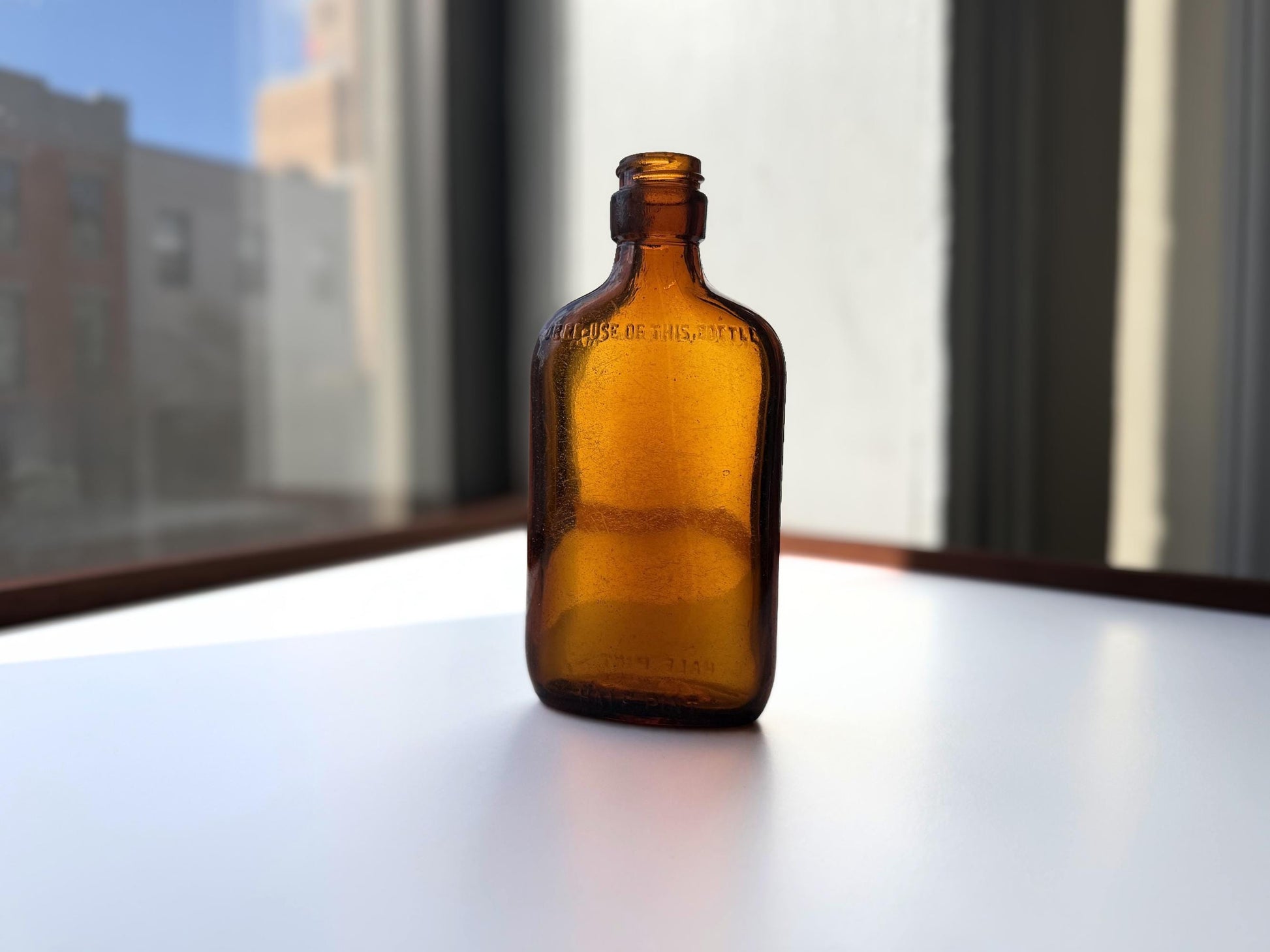 Vintage amber Federal Law flask 6.75 inches tall with beach-worn patina throughout - small chip on mouth - hand-recovered from NYC mid-century dumping grounds