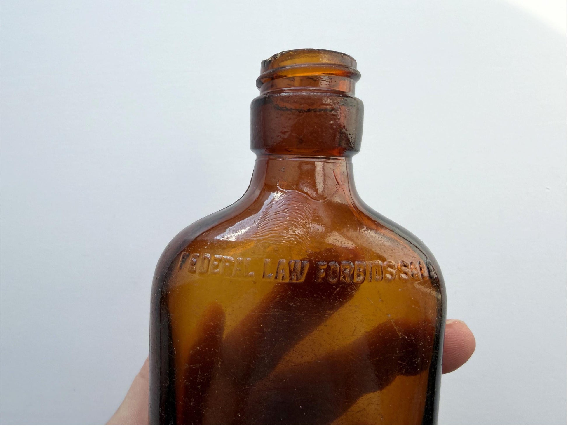 Vintage amber Federal Law flask 6.75 inches tall with beach-worn patina throughout - small chip on mouth - hand-recovered from NYC mid-century dumping grounds