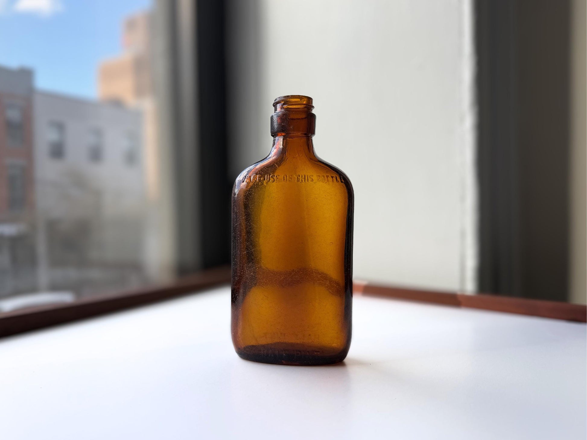 Vintage amber Federal Law flask 6.75 inches tall with beach-worn patina throughout - small chip on mouth - hand-recovered from NYC mid-century dumping grounds