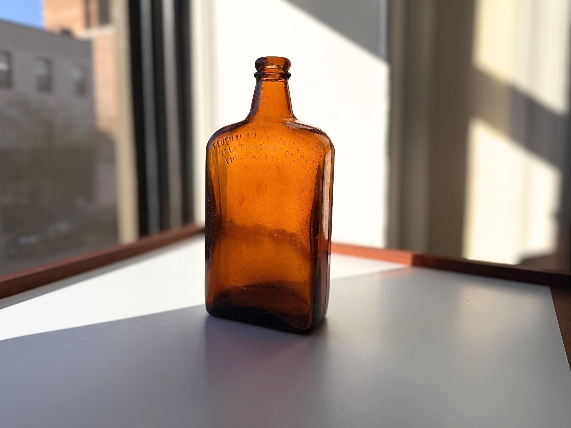 Vintage Bloch Brothers whisky bottle from Glasgow Scotland with distillery marking. Good condition showing minor scratches. Perfect for Scottish whisky collectors.