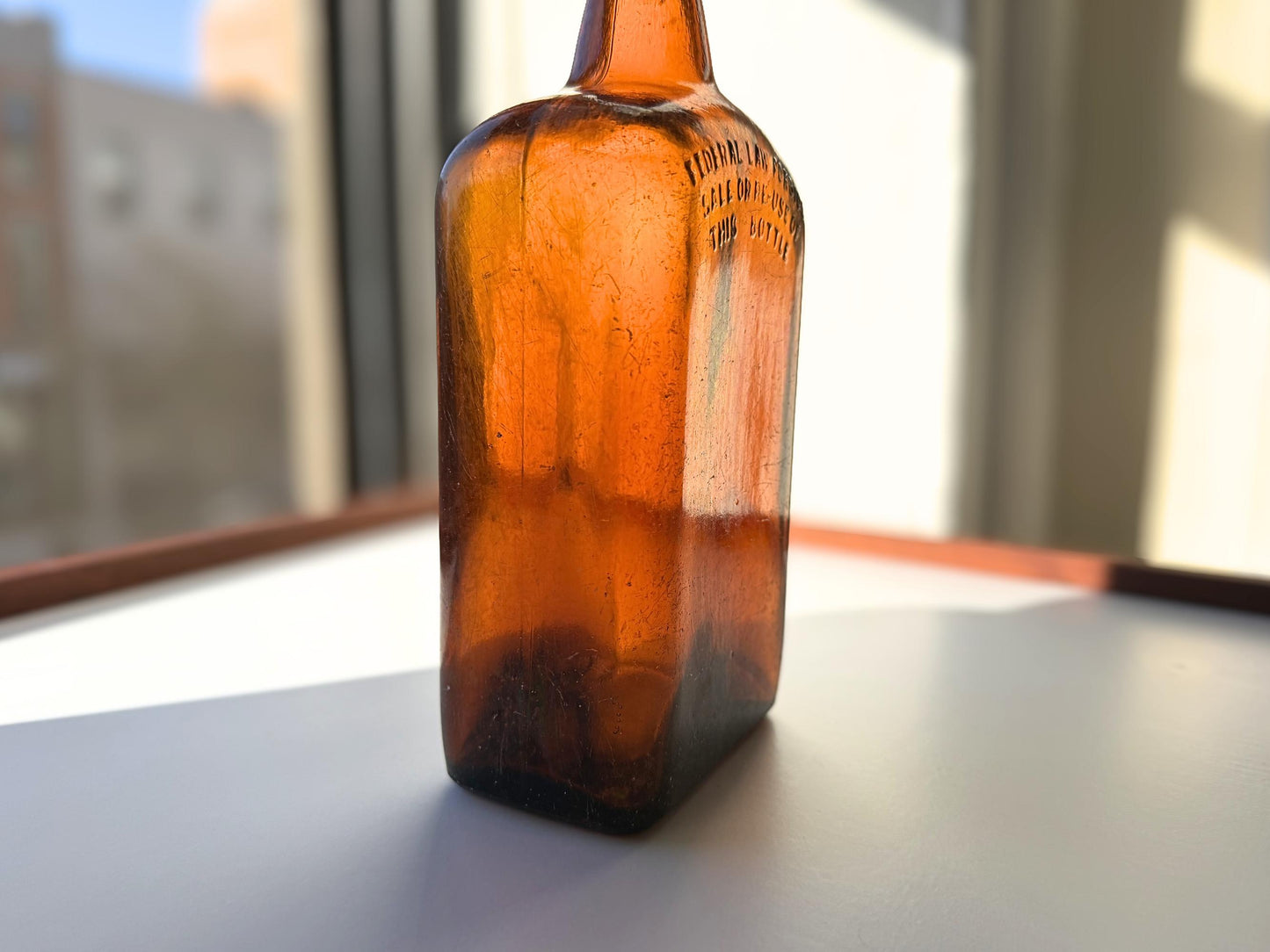 Vintage Bloch Brothers whisky bottle from Glasgow Scotland with distillery marking. Good condition showing minor scratches. Perfect for Scottish whisky collectors.