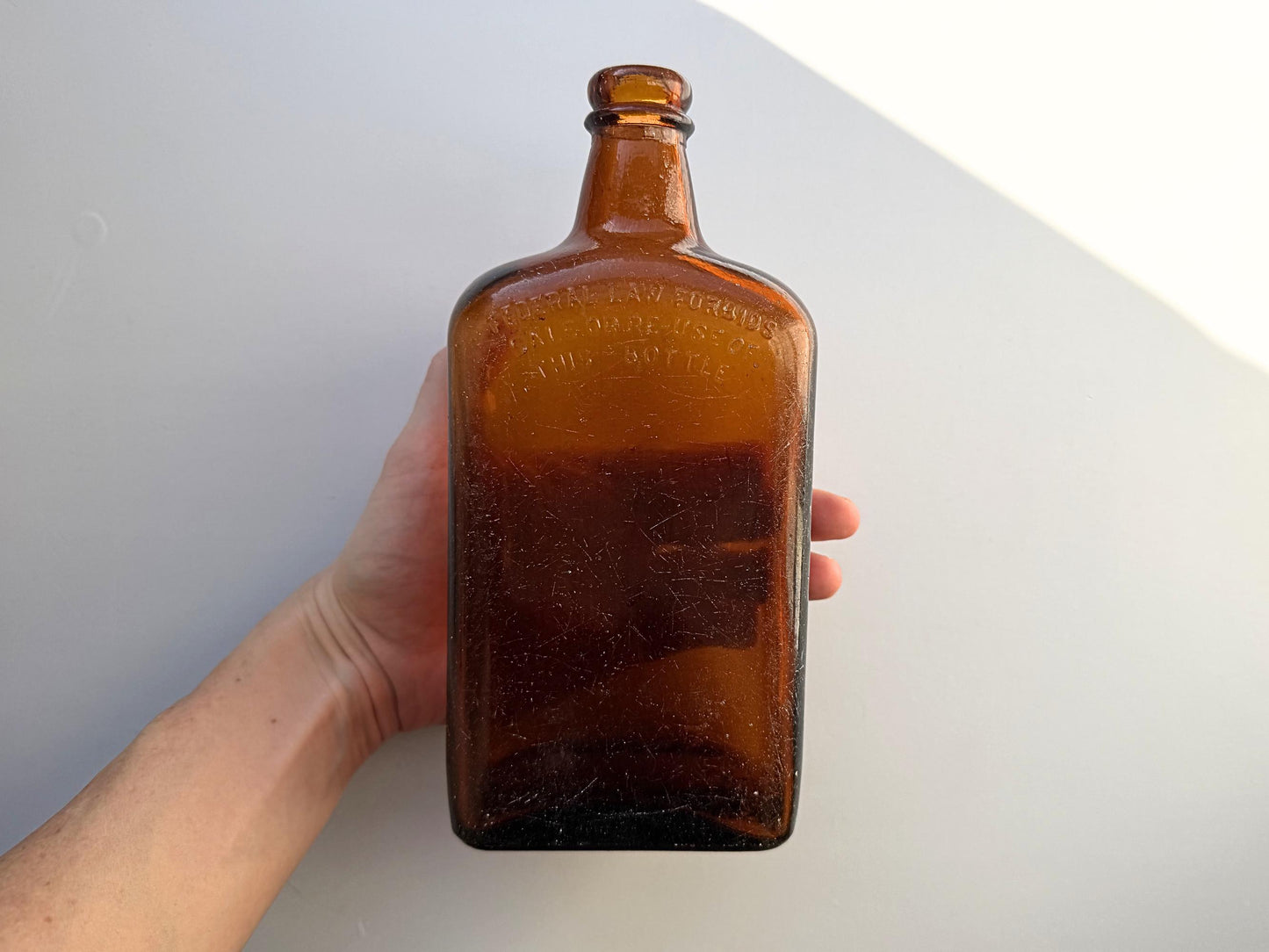 Vintage Bloch Brothers whisky bottle from Glasgow Scotland with distillery marking. Good condition showing minor scratches. Perfect for Scottish whisky collectors.