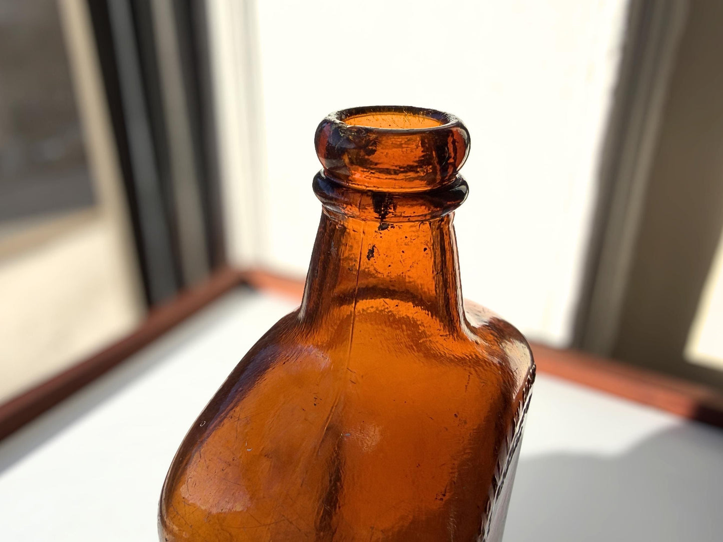 Vintage Bloch Brothers whisky bottle from Glasgow Scotland with distillery marking. Good condition showing minor scratches. Perfect for Scottish whisky collectors.