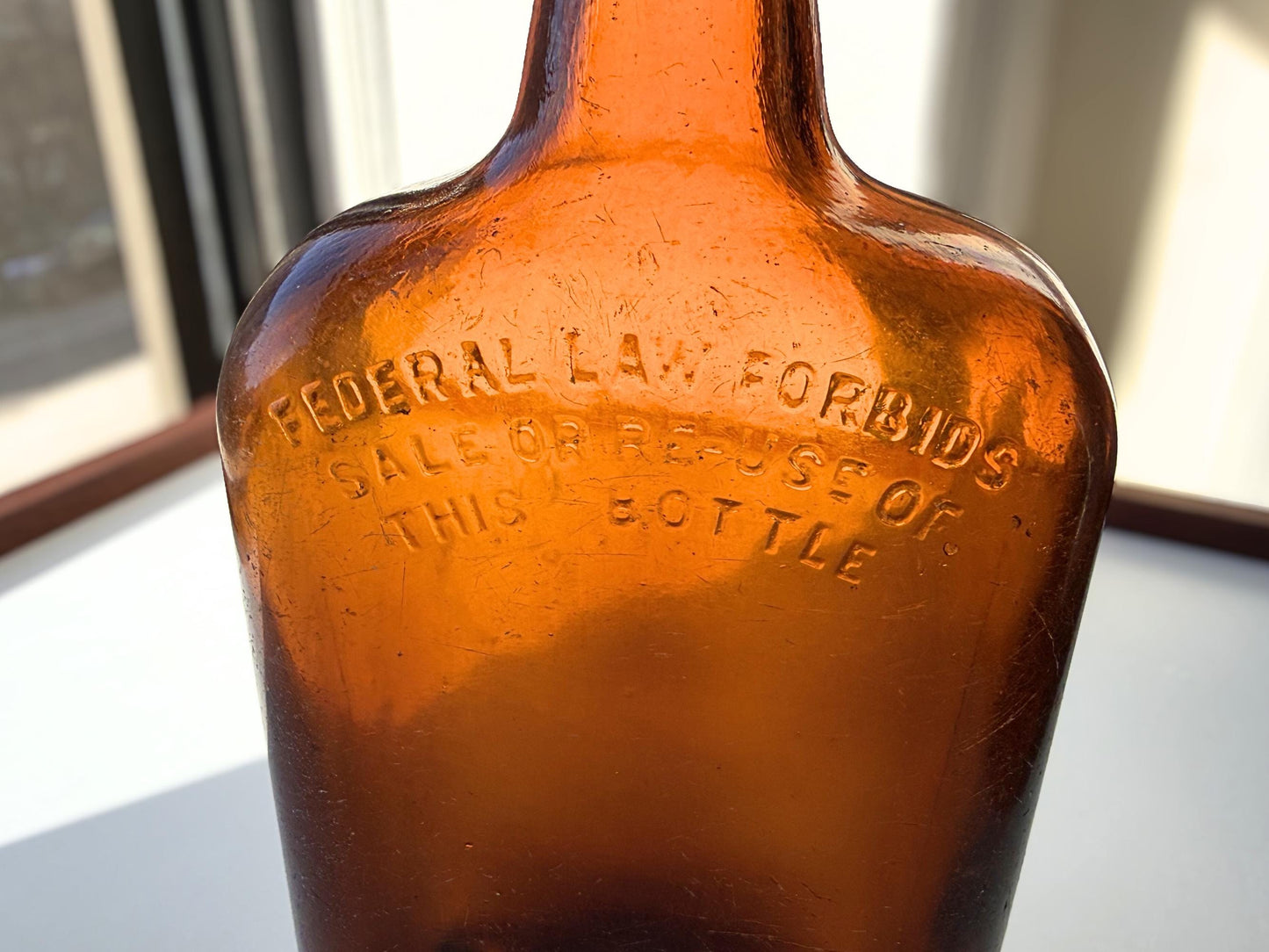 Vintage Bloch Brothers whisky bottle from Glasgow Scotland with distillery marking. Good condition showing minor scratches. Perfect for Scottish whisky collectors.