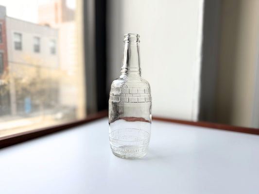 Vintage Cella Vineyards barrel-shaped clear glass wine bottle with embossed Full Pint marking. Authentic mid-century California winery bottle from Reedley, CA. 8.25 inches tall. Perfect for bar cart styling, wine collectors, rustic home decor.