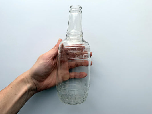 Vintage Cella Vineyards barrel-shaped clear glass wine bottle with embossed Full Pint marking. Authentic mid-century California winery bottle from Reedley, CA. 8.25 inches tall. Perfect for bar cart styling, wine collectors, rustic home decor.