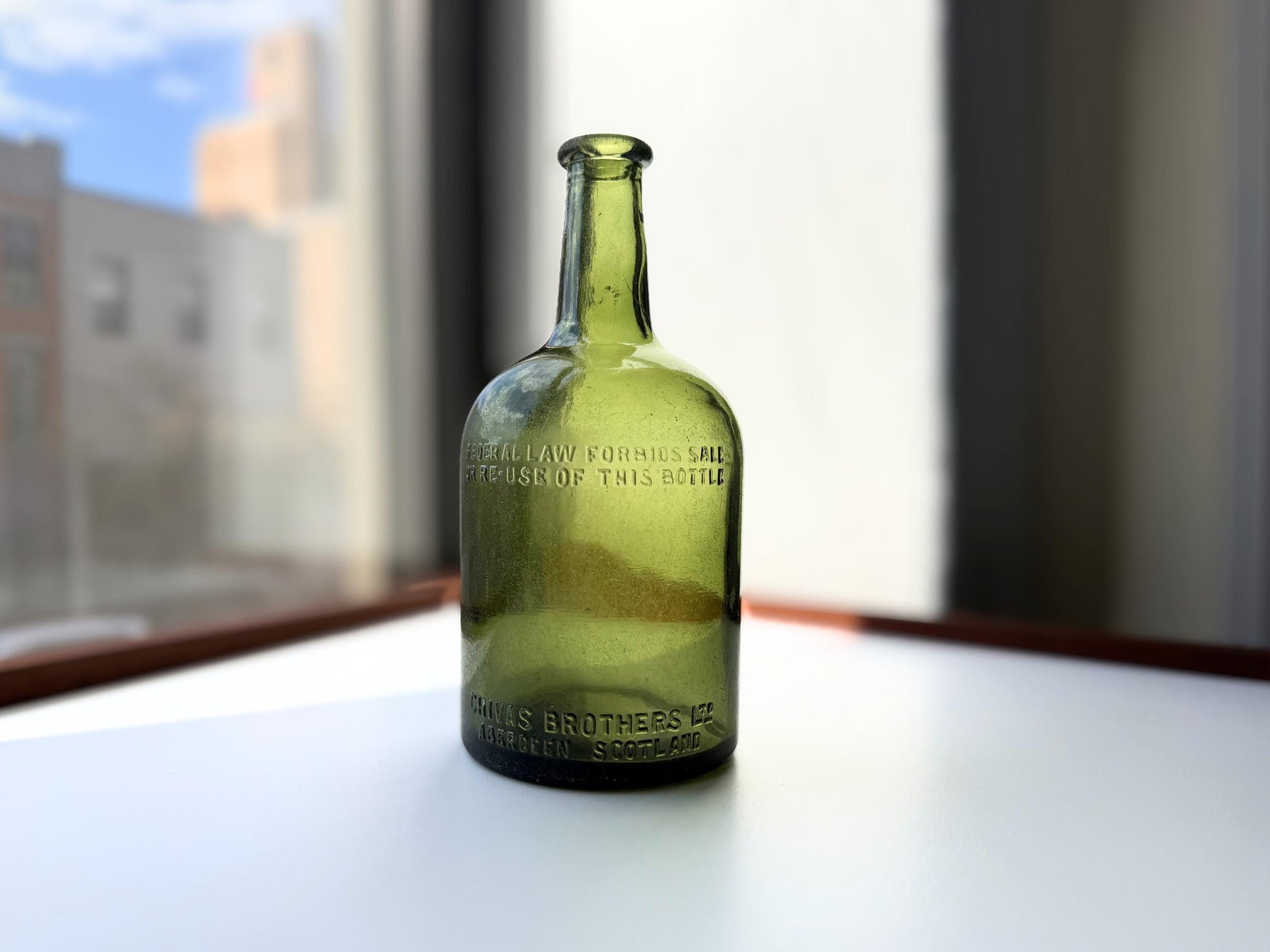 Vintage Chivas Brothers olive green scotch bottle, 8.25 inches tall, embossed with Federal Law Forbids Sale Or Re-Use Of This Bottle — hand-recovered NYC mid-century glass dated 1935 to 1964