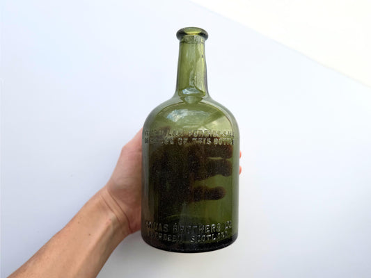 Vintage Chivas Brothers olive green scotch bottle, 8.25 inches tall, embossed with Federal Law Forbids Sale Or Re-Use Of This Bottle — hand-recovered NYC mid-century glass dated 1935 to 1964