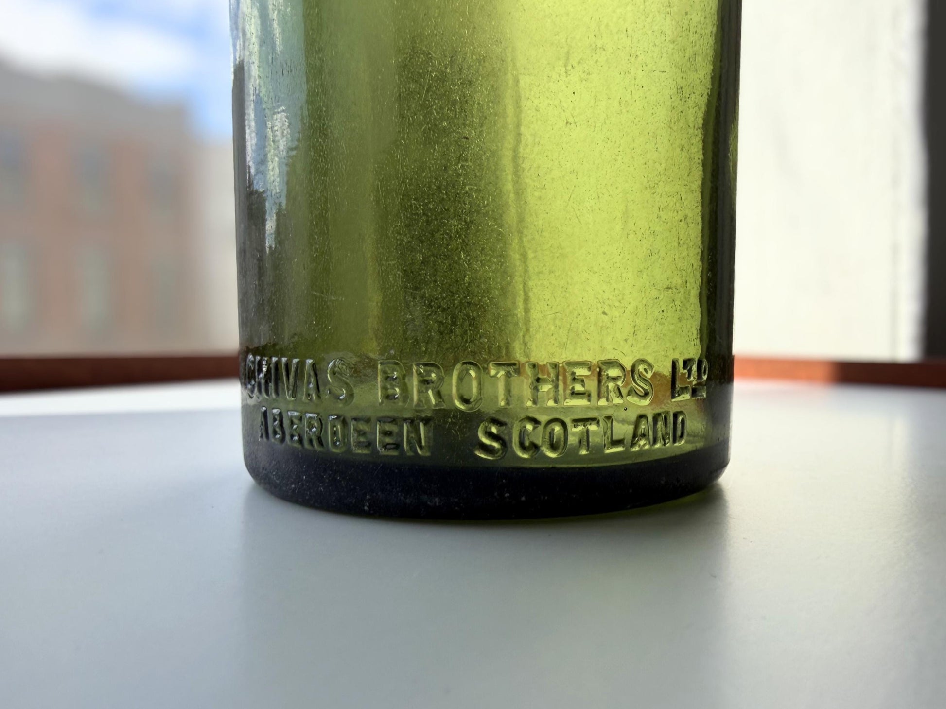 Vintage Chivas Brothers olive green scotch bottle, 8.25 inches tall, embossed with Federal Law Forbids Sale Or Re-Use Of This Bottle — hand-recovered NYC mid-century glass dated 1935 to 1964