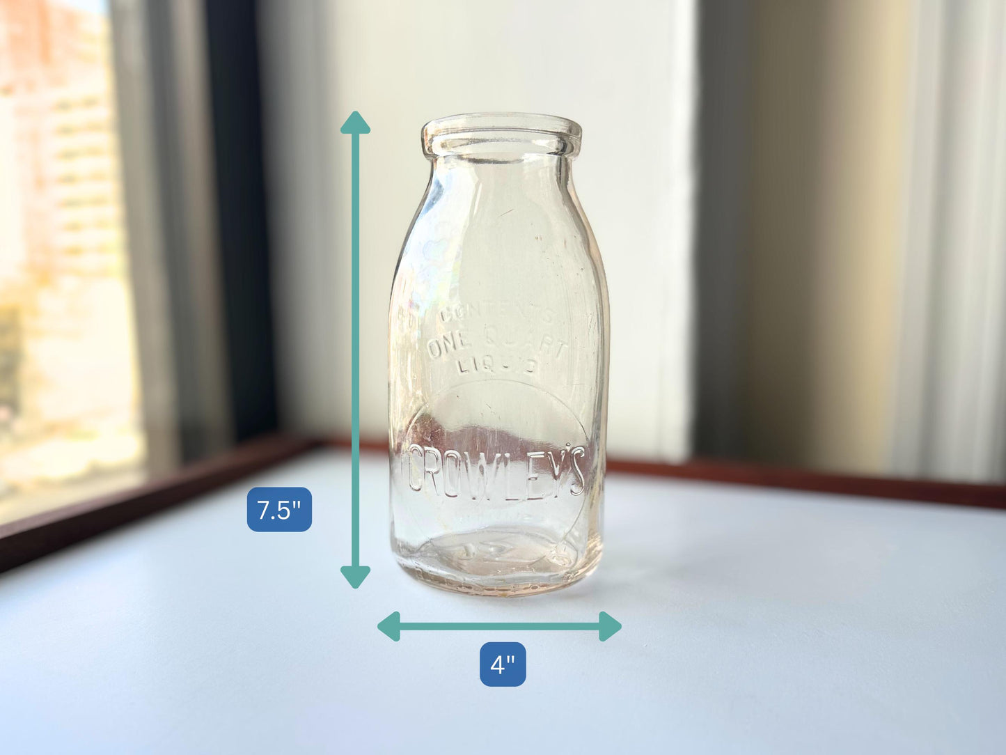 Vintage Crowley's one quart milk bottle with pink tinted glass and embossed Fine Quality lettering. Perfect for farmhouse cottagecore vintage kitchen decor, single stem vase, flower display, or dairy bottle collection. Rescued from NYC beaches.