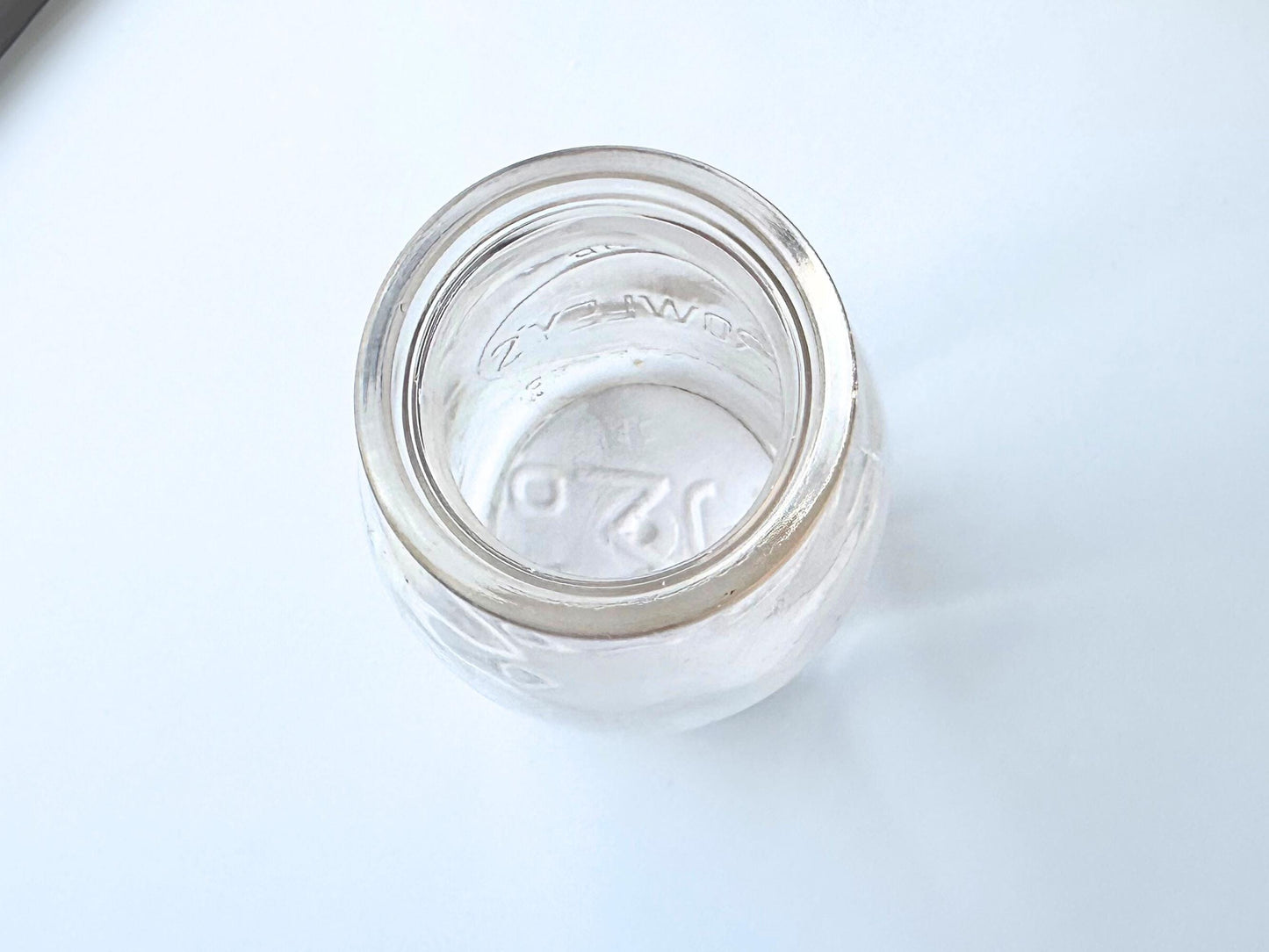 Vintage Crowley's one quart milk bottle with pink tinted glass and embossed Fine Quality lettering. Perfect for farmhouse cottagecore vintage kitchen decor, single stem vase, flower display, or dairy bottle collection. Rescued from NYC beaches.