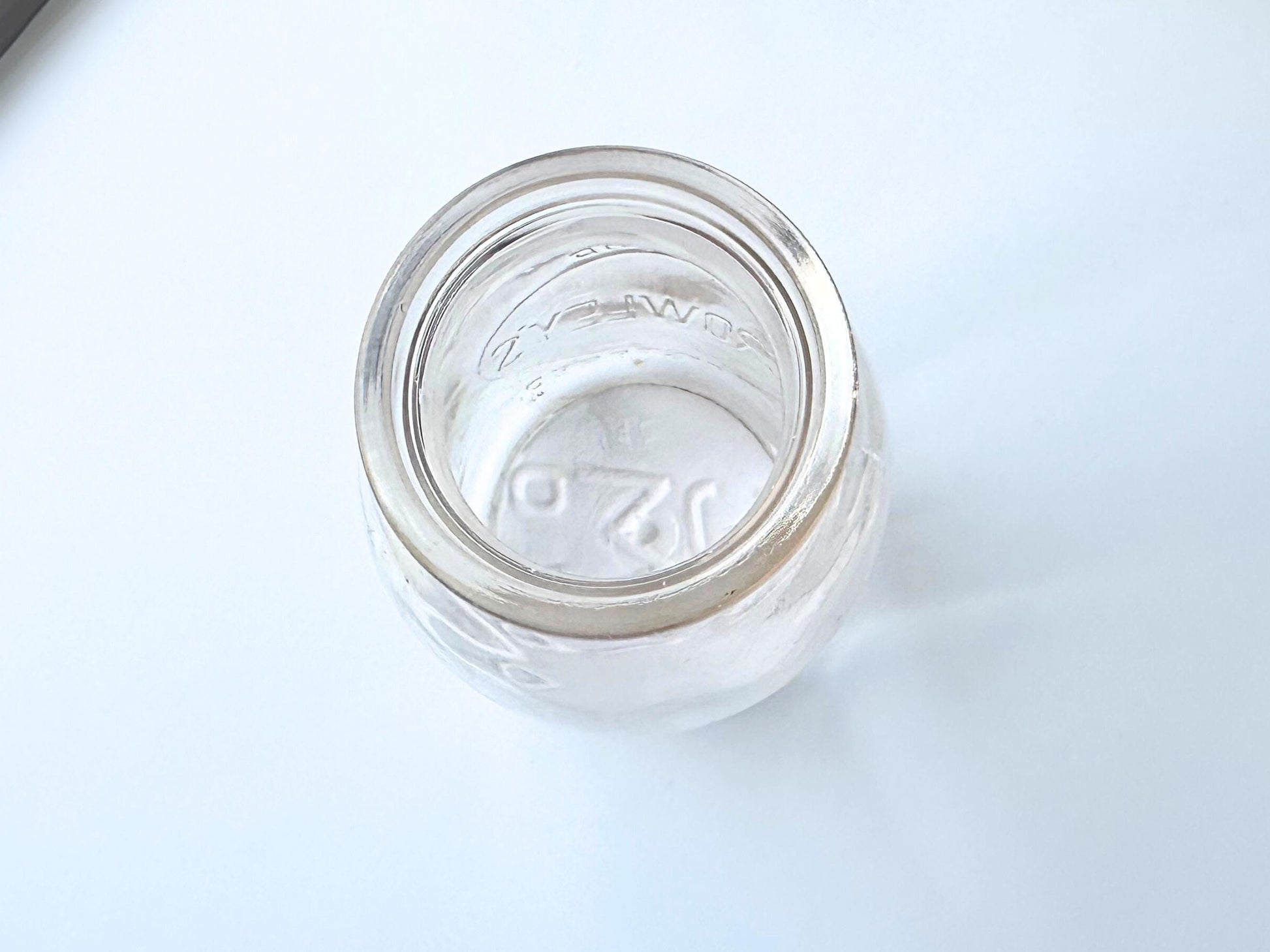 Vintage Crowley's one quart milk bottle with pink tinted glass and embossed Fine Quality lettering. Perfect for farmhouse cottagecore vintage kitchen decor, single stem vase, flower display, or dairy bottle collection. Rescued from NYC beaches.