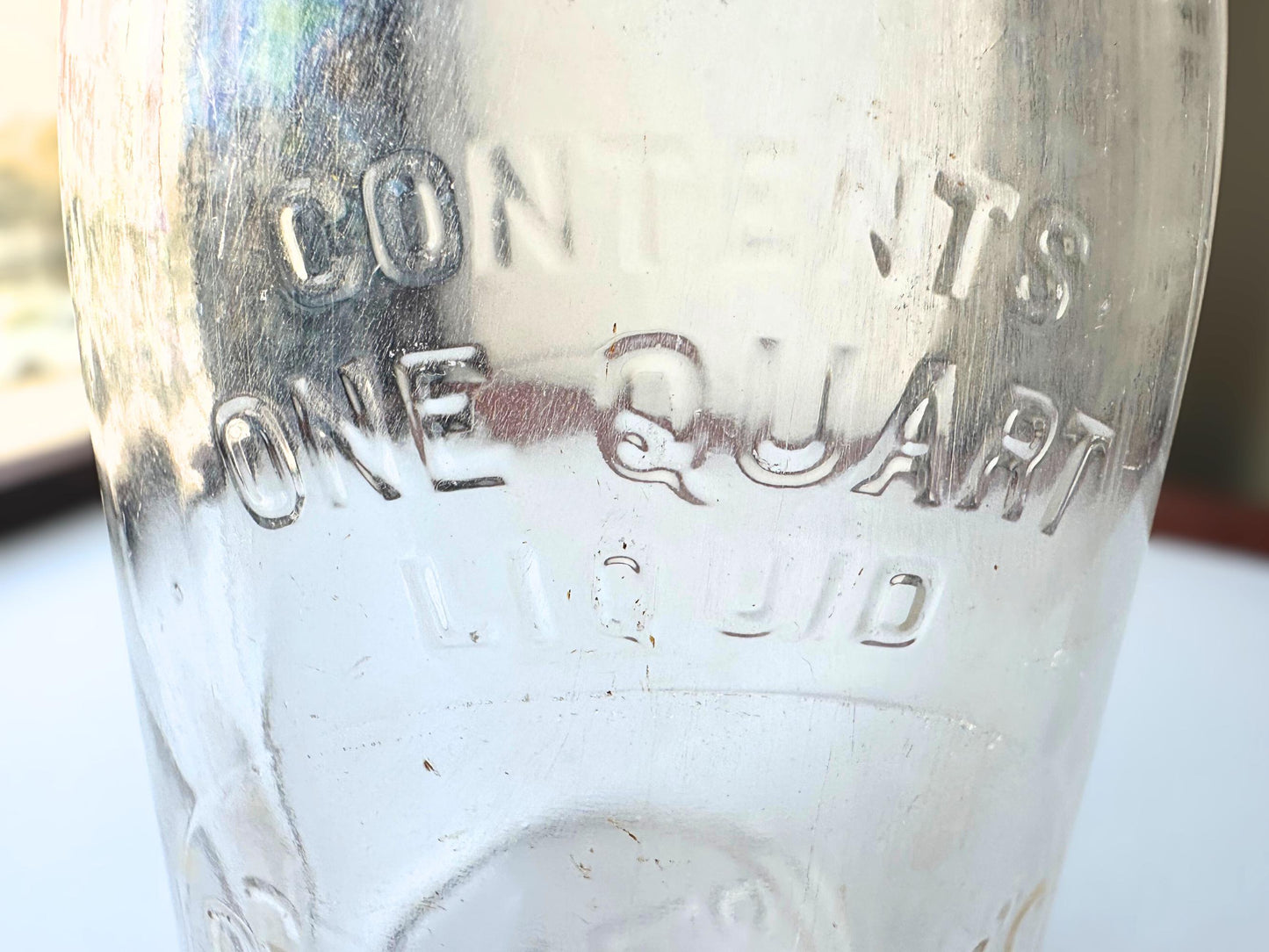 Vintage Crowley's one quart milk bottle with pink tinted glass and embossed Fine Quality lettering. Perfect for farmhouse cottagecore vintage kitchen decor, single stem vase, flower display, or dairy bottle collection. Rescued from NYC beaches.