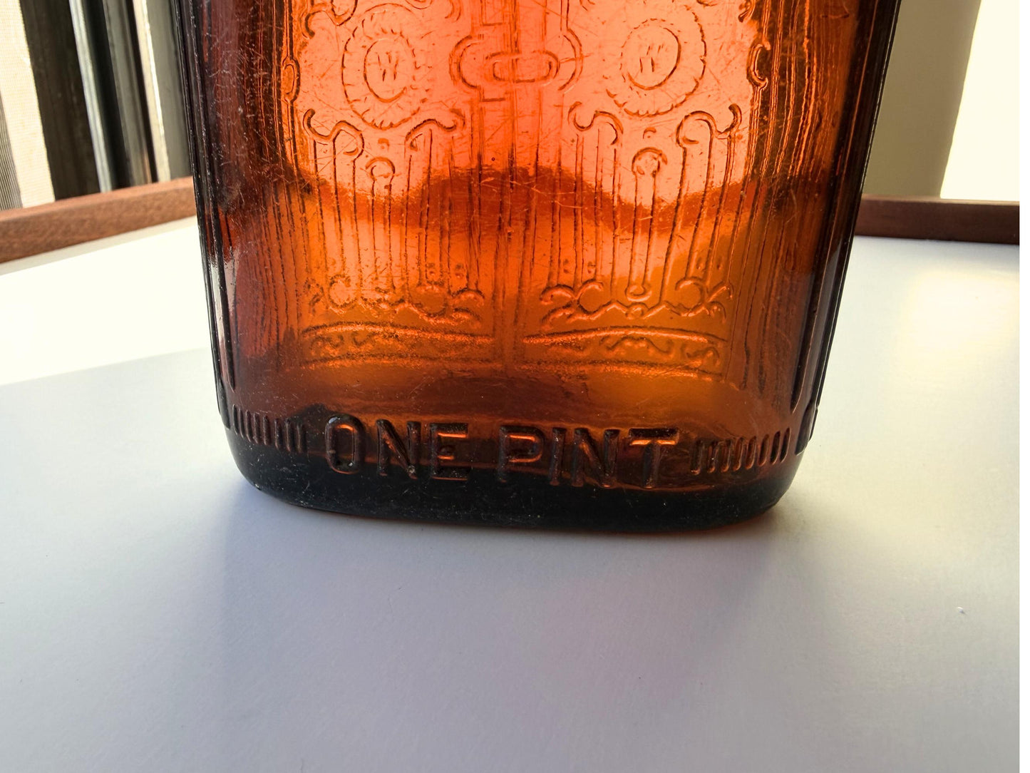 Vintage Hiram Walker amber flask with bottled by Hiram Walker marking. Good condition showing authentic wear. Perfect for spirits collectors and vintage bar displays.