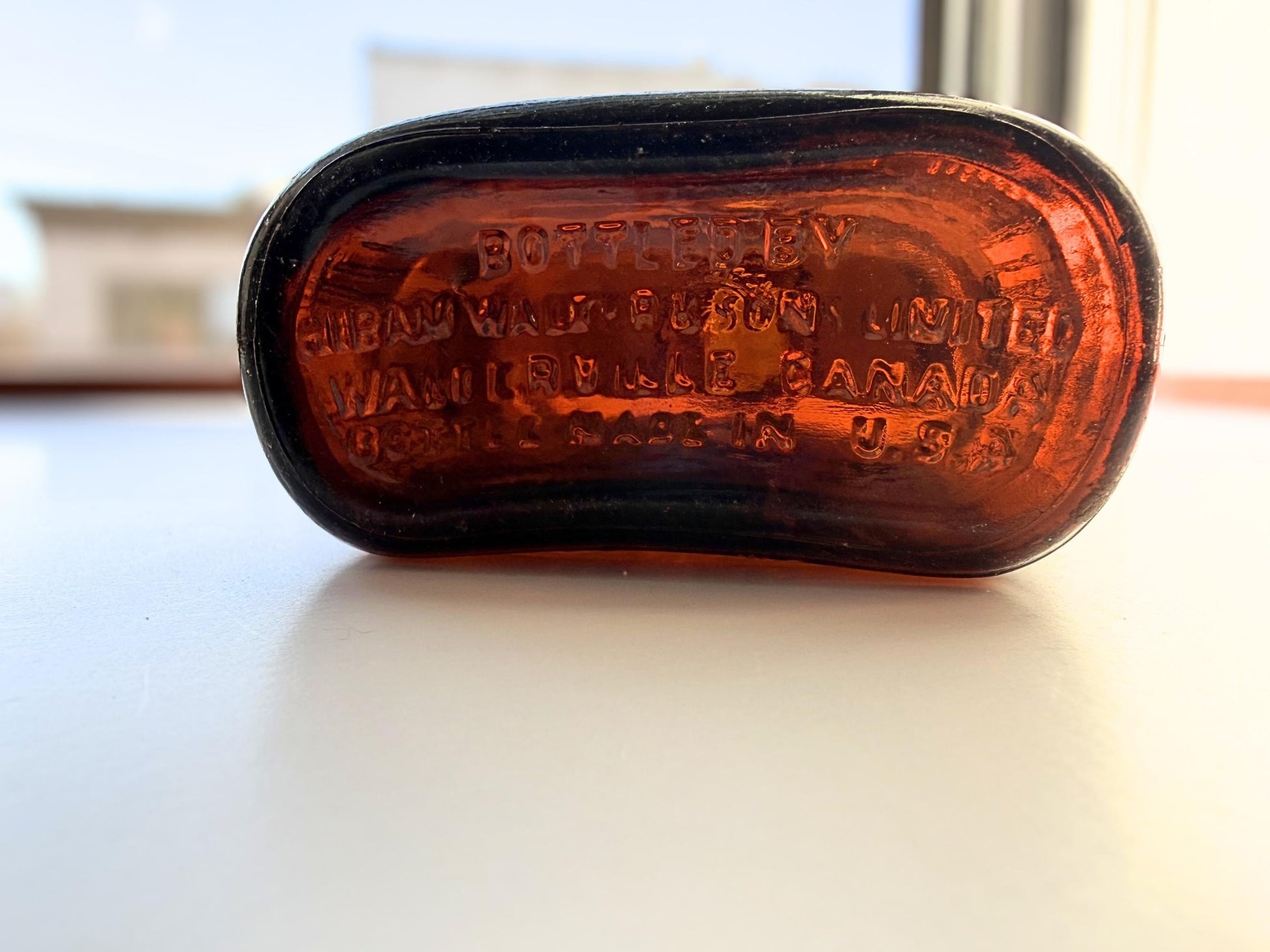 Vintage Hiram Walker amber flask with bottled by Hiram Walker marking. Good condition showing authentic wear. Perfect for spirits collectors and vintage bar displays.