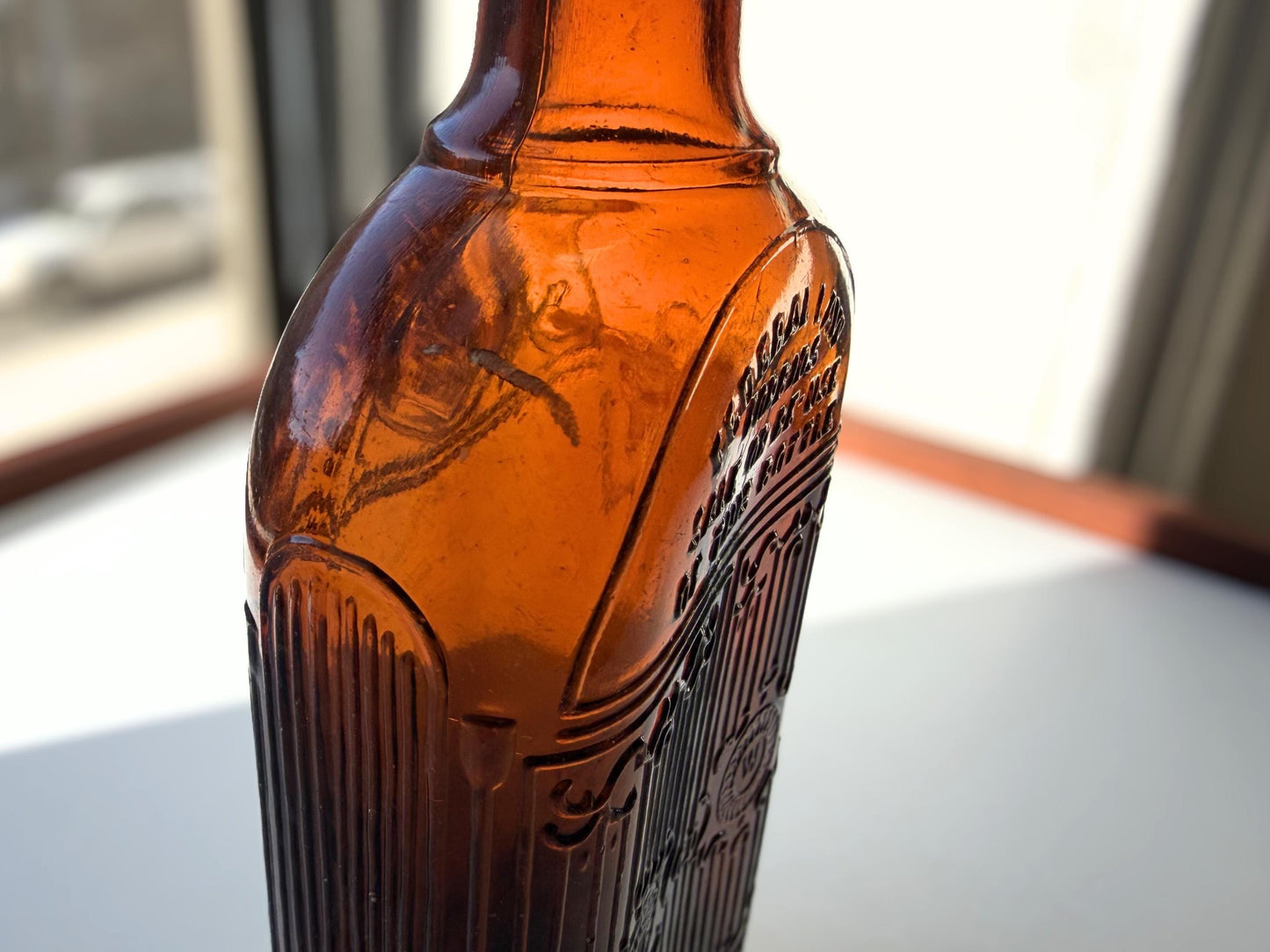 Vintage Hiram Walker amber flask with bottled by Hiram Walker marking. Good condition showing authentic wear. Perfect for spirits collectors and vintage bar displays.
