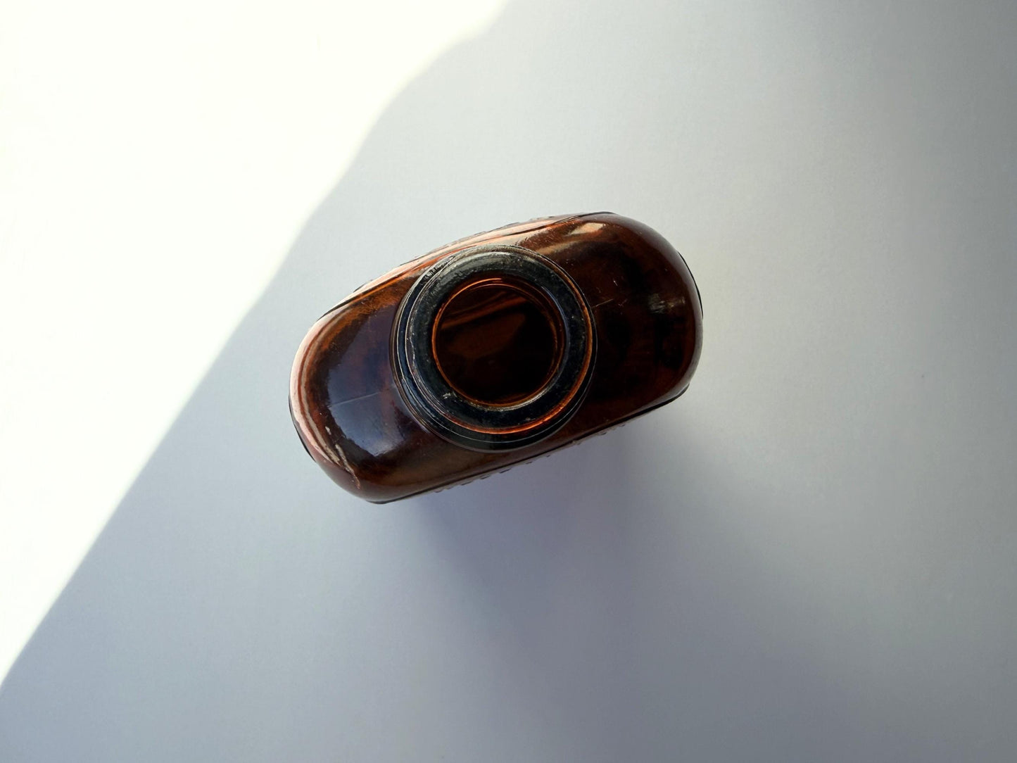 Vintage Hiram Walker amber flask with bottled by Hiram Walker marking. Good condition showing authentic wear. Perfect for spirits collectors and vintage bar displays.