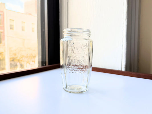 Vintage 1920s-1940s Kingfish Brand clear glass herring jar with bold embossed lettering from Evelyn Packing Company in New York. Perfect for windowsill displays, vintage kitchen collections, and farmhouse or cottagecore decor.