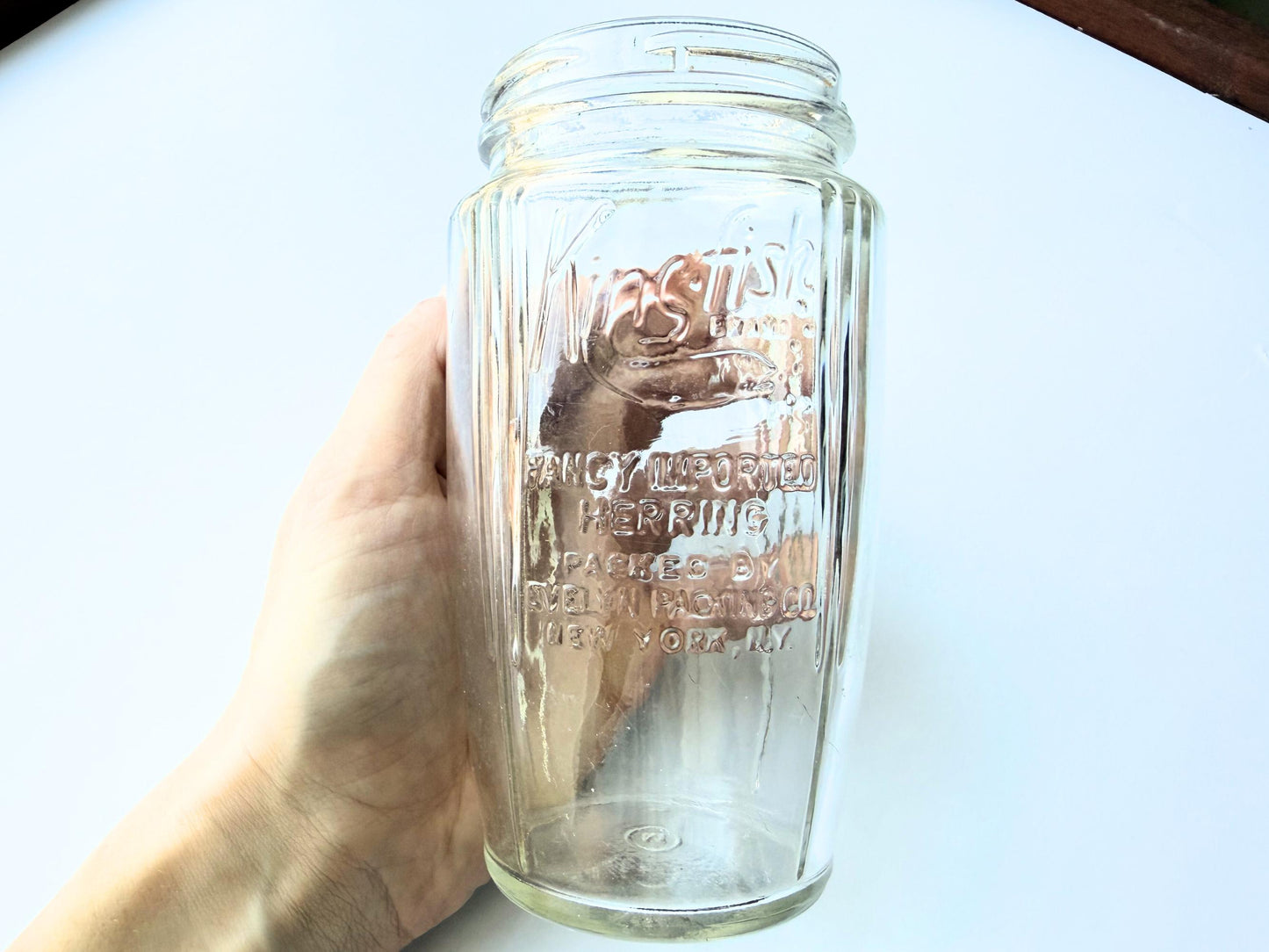 Vintage 1920s-1940s Kingfish Brand clear glass herring jar with bold embossed lettering from Evelyn Packing Company in New York. Perfect for windowsill displays, vintage kitchen collections, and farmhouse or cottagecore decor.