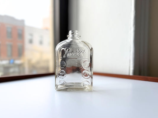 Vintage Purex clear glass bottle with ribbed center panel, rectangular form, and embossed label. Authentic early 20th century household advertising bottle rescued from NYC beaches. Perfect for farmhouse shelving, laundry room decor, bud vase styling.
