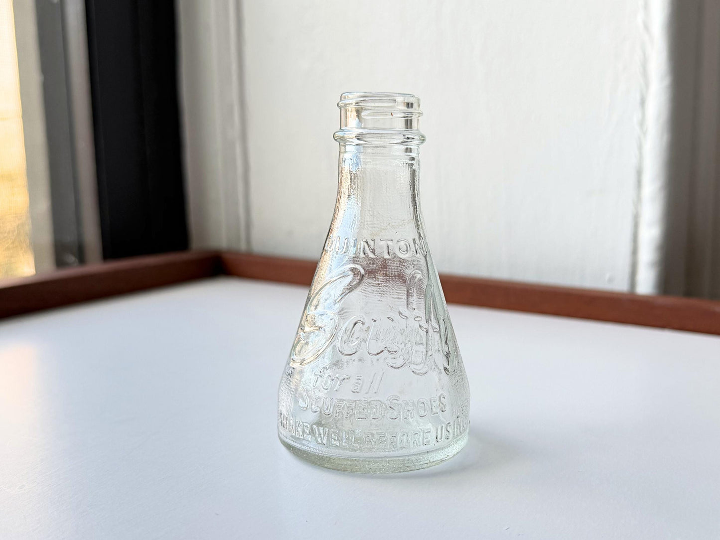 Vintage 1940s-1960s Quintone Scuffy shoe polish bottle with embossed lettering from KJ Quinn and Co Inc Malden Massachusetts. Perfect for vintage product collectors, bathroom displays, and cottagecore decor.
