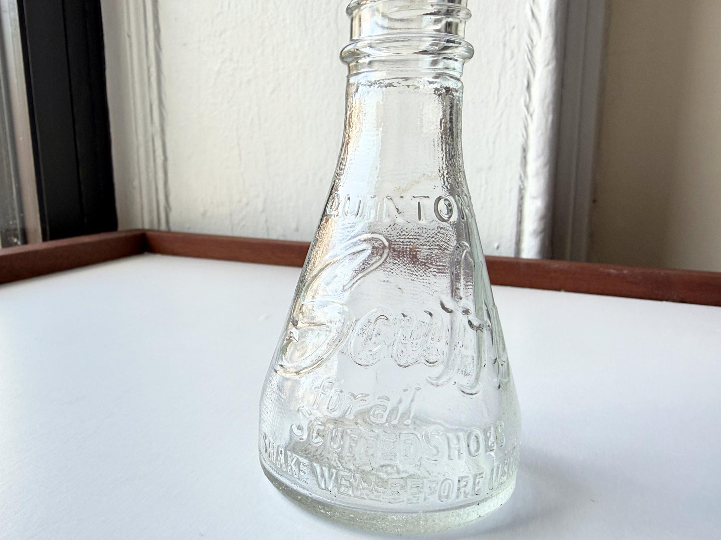Vintage 1940s-1960s Quintone Scuffy shoe polish bottle with embossed lettering from KJ Quinn and Co Inc Malden Massachusetts. Perfect for vintage product collectors, bathroom displays, and cottagecore decor.