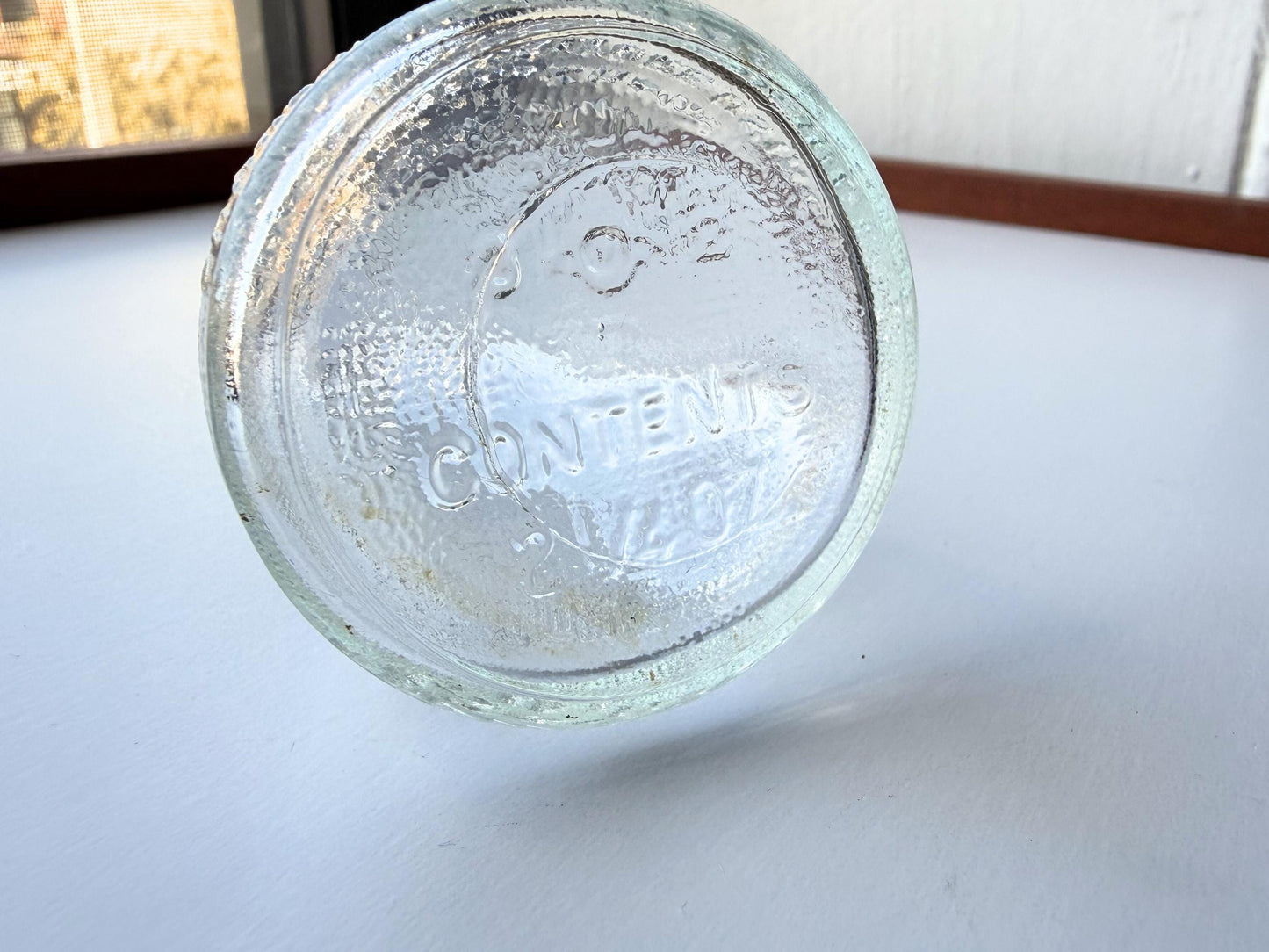 Vintage 1940s-1960s Quintone Scuffy shoe polish bottle with embossed lettering from KJ Quinn and Co Inc Malden Massachusetts. Perfect for vintage product collectors, bathroom displays, and cottagecore decor.