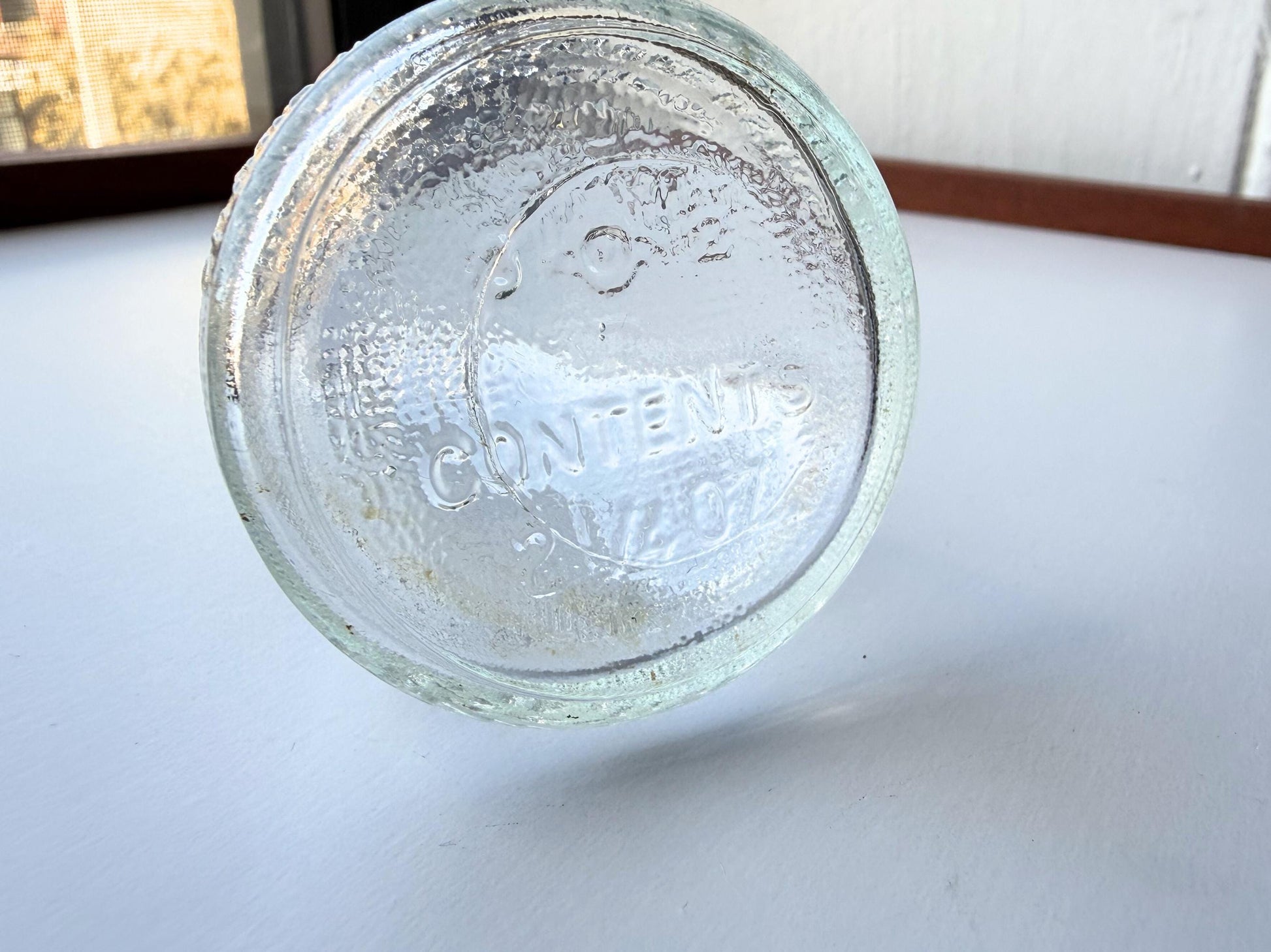 Vintage 1940s-1960s Quintone Scuffy shoe polish bottle with embossed lettering from KJ Quinn and Co Inc Malden Massachusetts. Perfect for vintage product collectors, bathroom displays, and cottagecore decor.