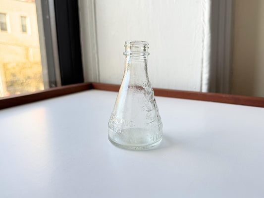 Vintage 1940s-1960s Quintone Scuffy shoe polish bottle with embossed lettering from KJ Quinn and Co Inc Malden Massachusetts. Perfect for vintage product collectors, bathroom displays, and cottagecore decor.