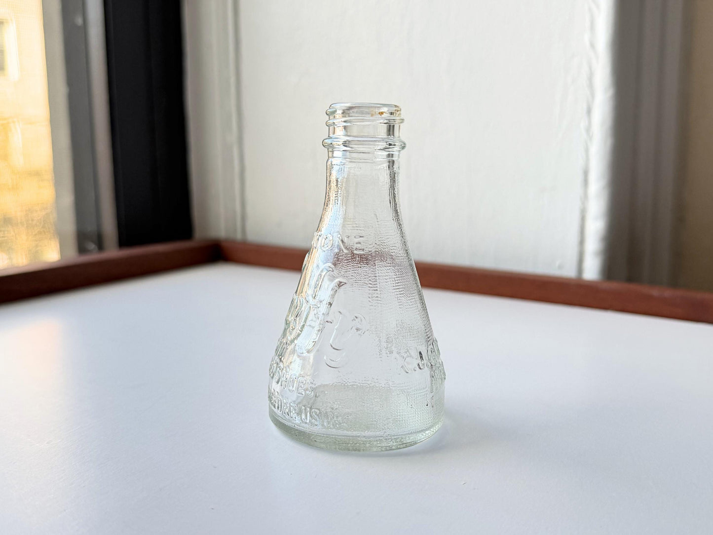 Vintage 1940s-1960s Quintone Scuffy shoe polish bottle with embossed lettering from KJ Quinn and Co Inc Malden Massachusetts. Perfect for vintage product collectors, bathroom displays, and cottagecore decor.