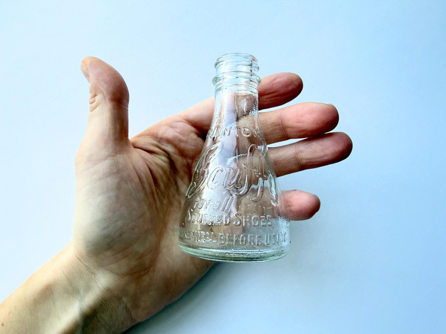 Vintage 1940s-1960s Quintone Scuffy shoe polish bottle with embossed lettering from KJ Quinn and Co Inc Malden Massachusetts. Perfect for vintage product collectors, bathroom displays, and cottagecore decor.