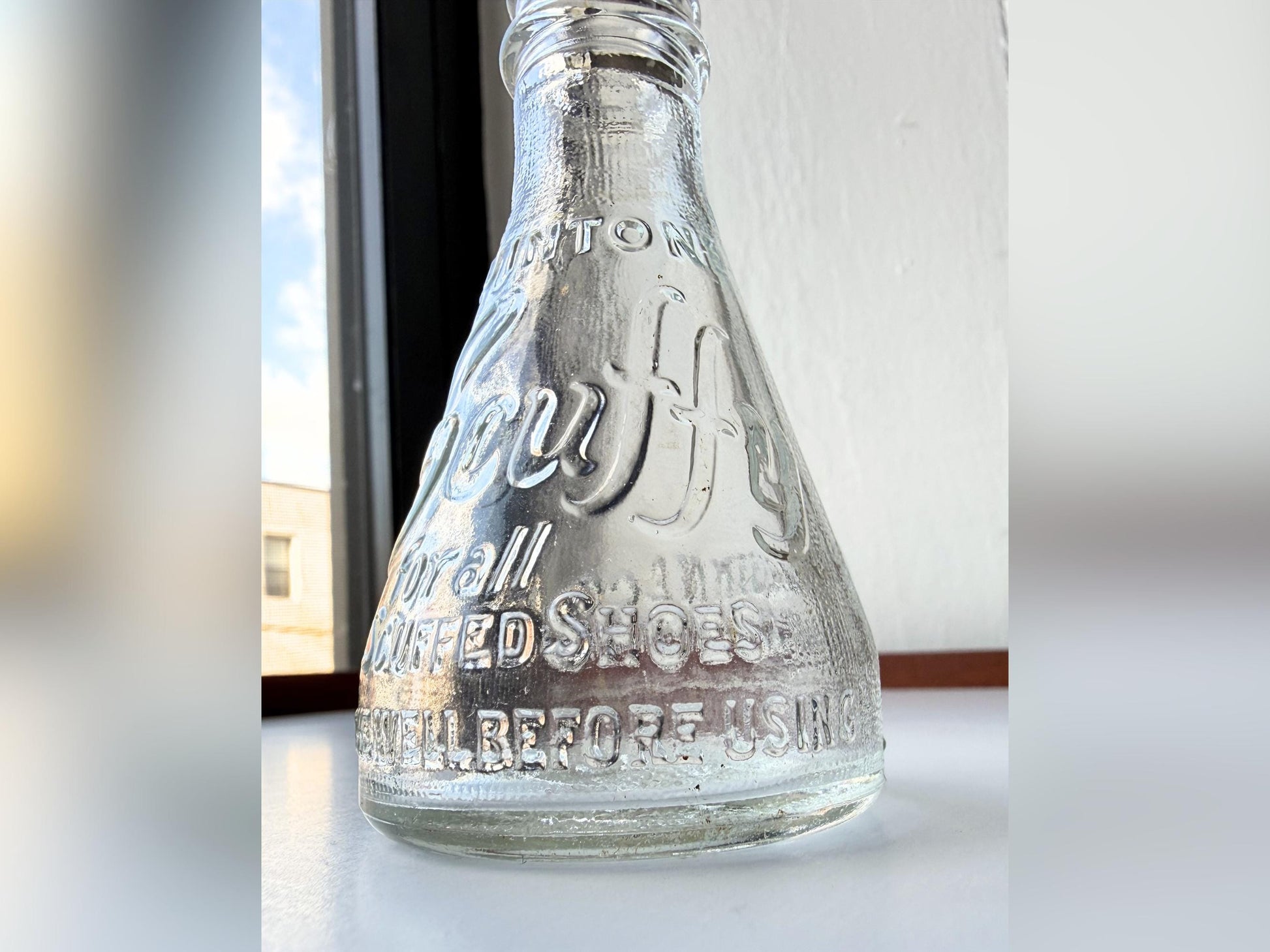 Vintage 1940s-1960s Quintone Scuffy shoe polish bottle with embossed lettering from KJ Quinn and Co Inc Malden Massachusetts. Perfect for vintage product collectors, bathroom displays, and cottagecore decor.