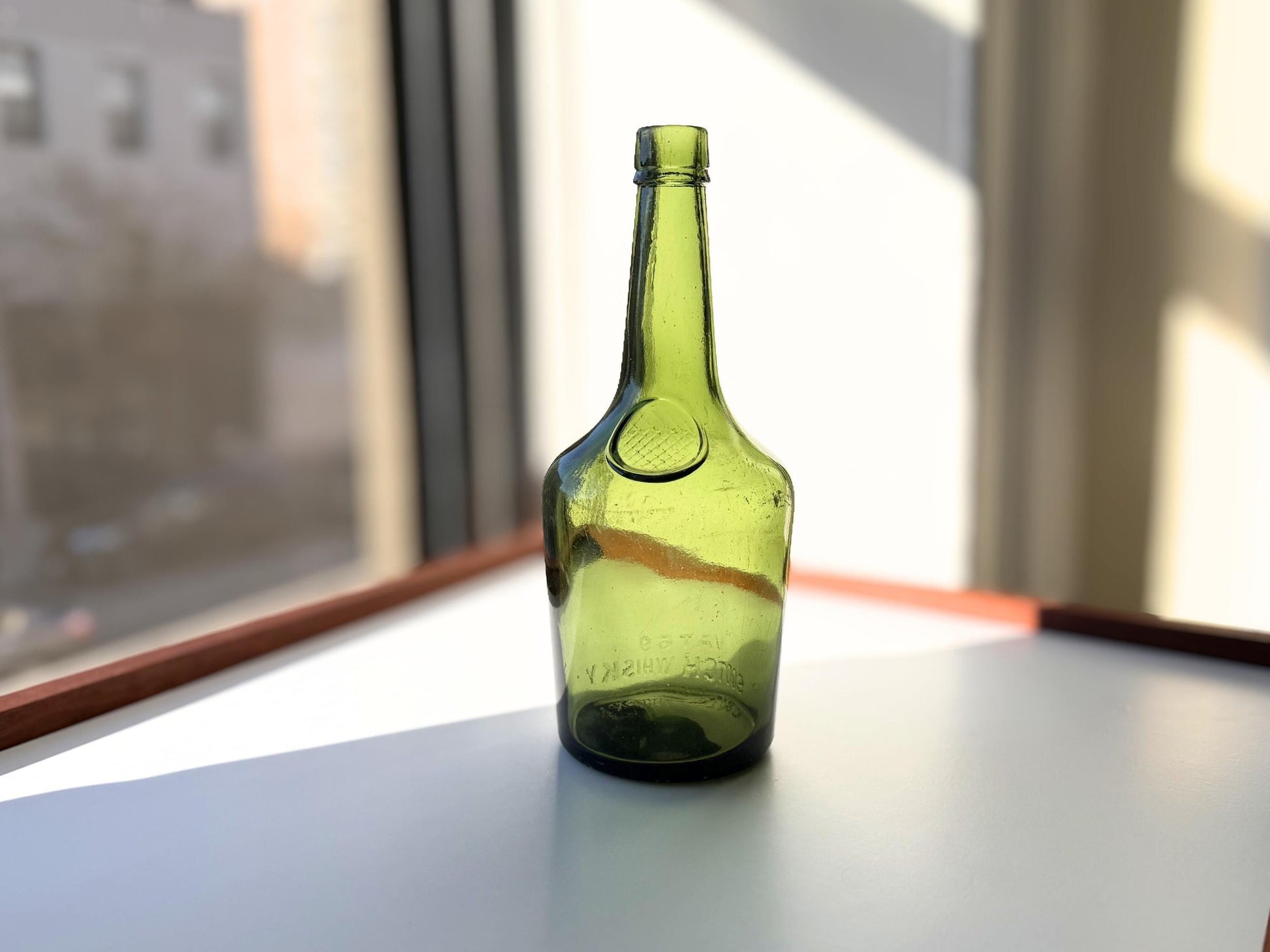 Vintage VAT69 Scotch whisky bottle with embossed lettering and Federal Law marking. Perfect for whisky collectors and Scottish spirits enthusiasts – Brooklyn Sea Glass