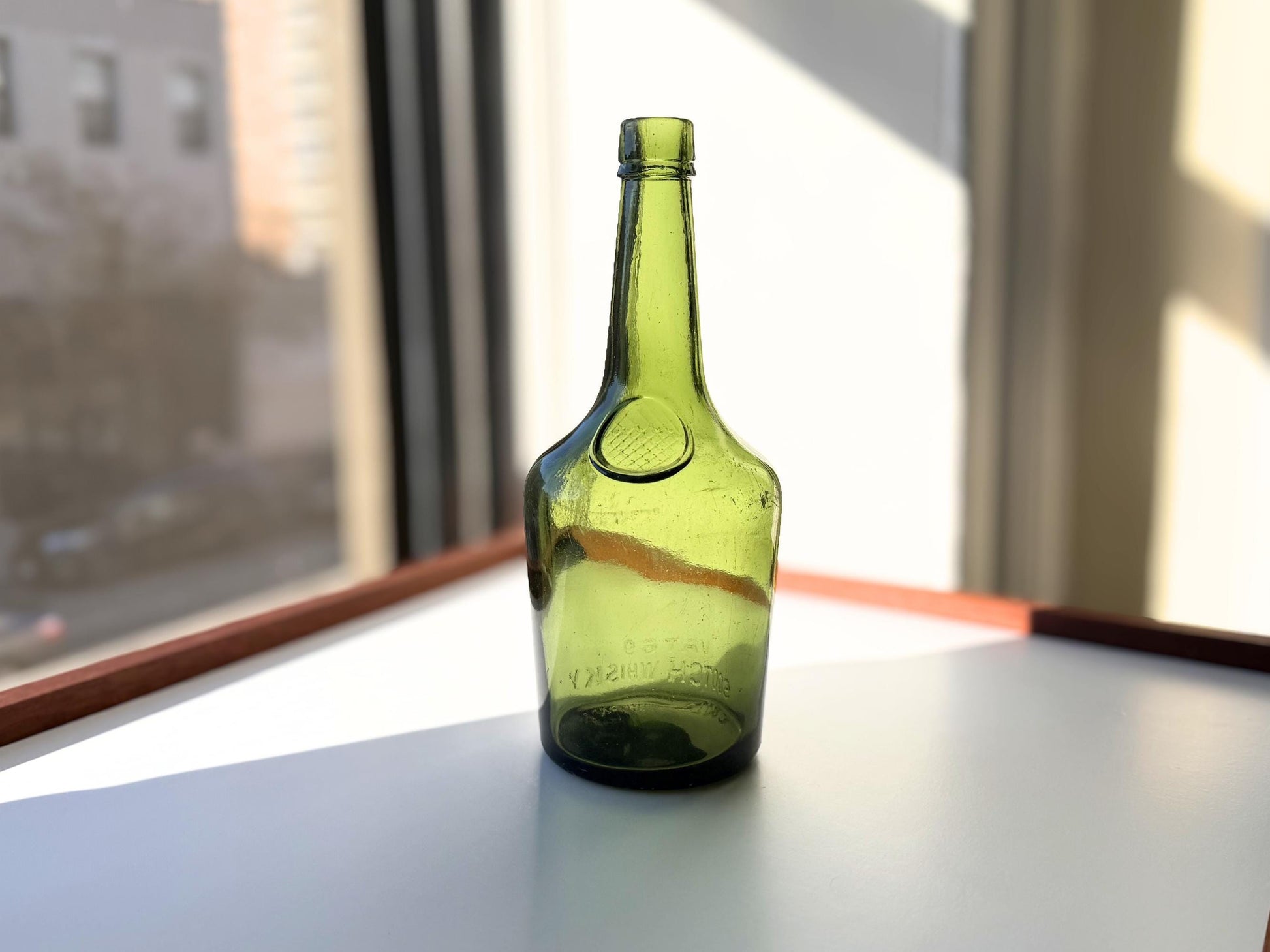 Vintage VAT69 Scotch whisky bottle with embossed lettering and Federal Law marking. Perfect for whisky collectors and Scottish spirits enthusiasts – Brooklyn Sea Glass