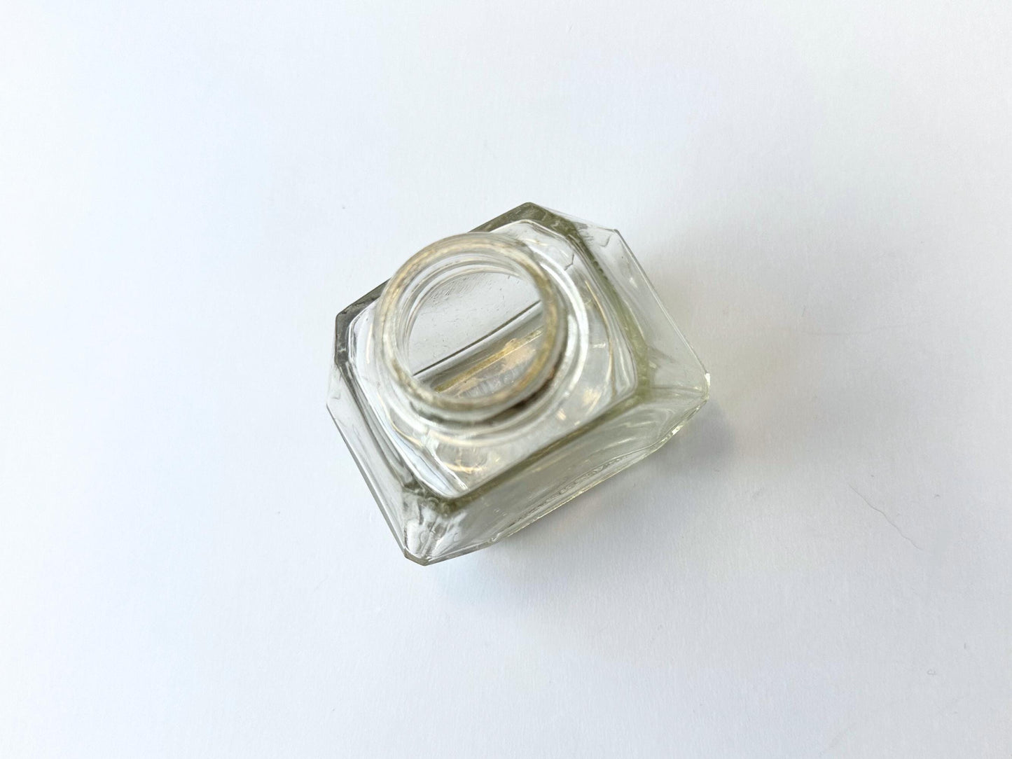 Vintage Waterman's 2oz ink bottle with hexagonal shape and patent marking. Perfect for vintage stationery collectors, office displays, and writing enthusiasts.