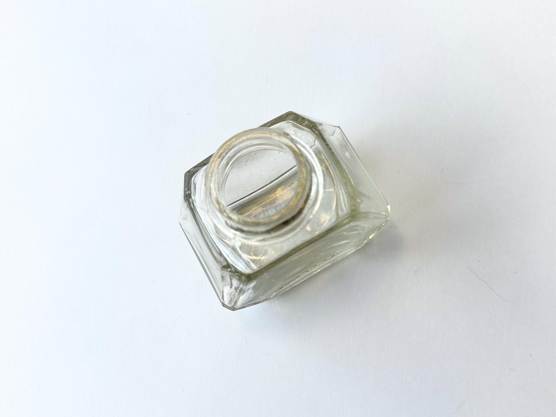 Vintage Waterman's 2oz ink bottle with hexagonal shape and patent marking. Perfect for vintage stationery collectors, office displays, and writing enthusiasts.