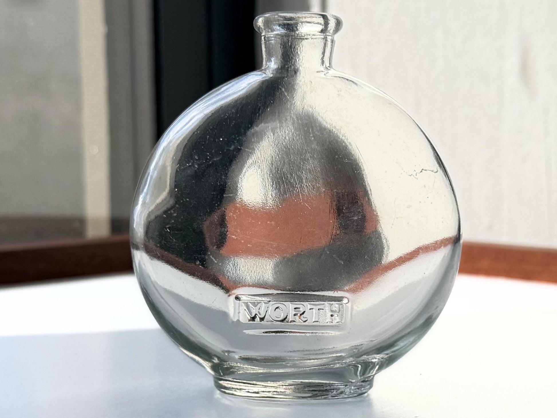 Vintage House of Worth clear crystal globe perfume bottle 4 inches tall with WORTH embossed cartouche - French haute couture heritage piece hand-recovered from NYC