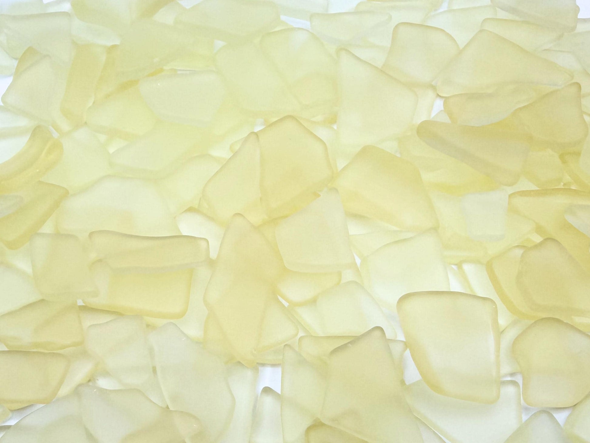 Buttercream yellow tumbled sea glass pieces with smooth frosted edges in small to medium sizes perfect for spring jewelry making mosaics resin art wedding decor and coastal home accents made from recycled vintage glass